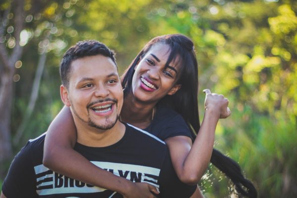 hispanic man and woman smiling